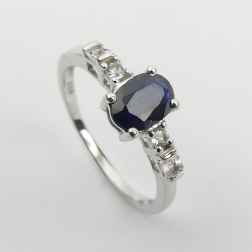 74 - Sterling silver sapphire and topaz ring, 1.5 grams, 6.8mm, Size N. UK Postage £12.