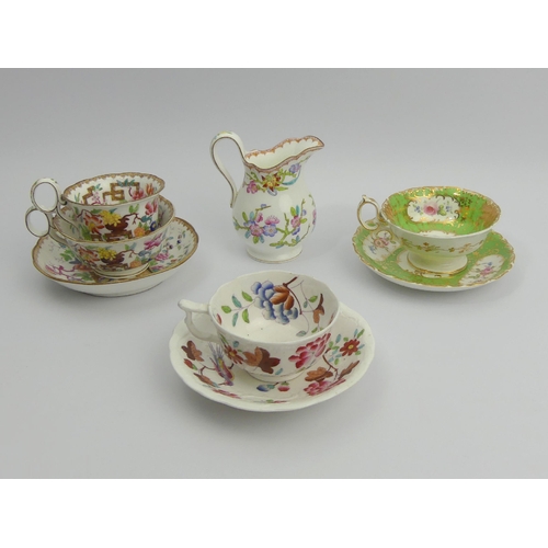 207 - A Minton Chinese tree design tea cup, coffee cup and saucer, a floral cream jug and two cabinet cups... 