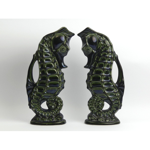 211 - A pair of Fosters pottery green glazed seahorse jugs, 36.5cm. UK Postage £18.