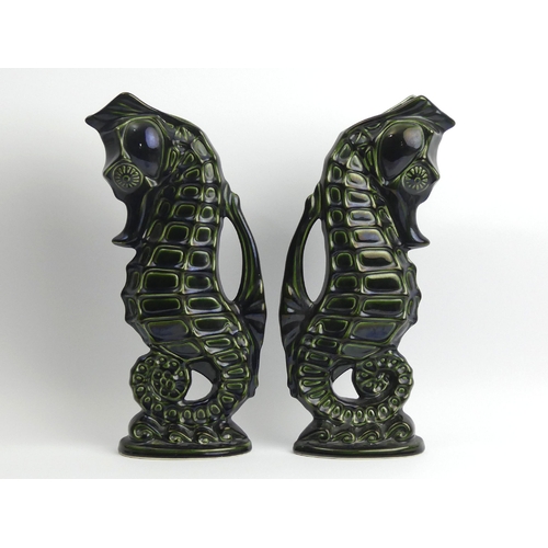 211 - A pair of Fosters pottery green glazed seahorse jugs, 36.5cm. UK Postage £18.