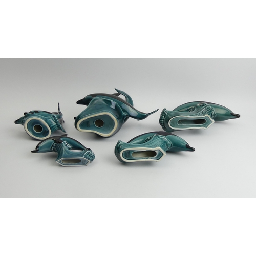 220 - Five Poole pottery dolphin figures, largest 23cm high. UK Postage £15.