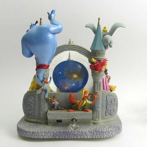 226 - Disney castle musical snow globe with all the Disney Characters, 26cm high. UK Postage £20.
