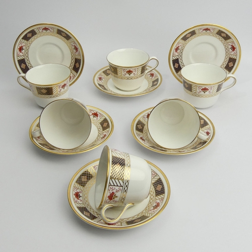 244 - Six Royal Crown Derby A1253 Imari cups and saucers, cups 7cm saucers 14.5cm. UK Postage £18.