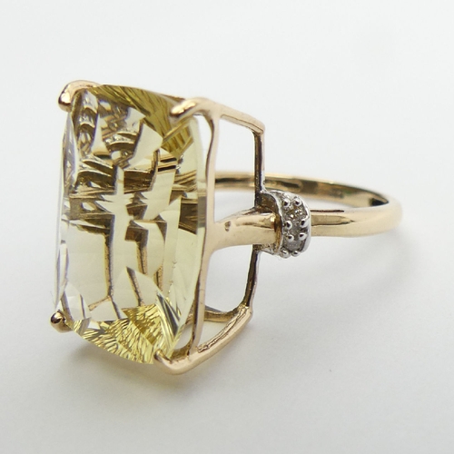 75 - 9ct gold yellow quartz and diamond ring, 4.4 grams, 17. 8mm, Size N. UK Postage £12.