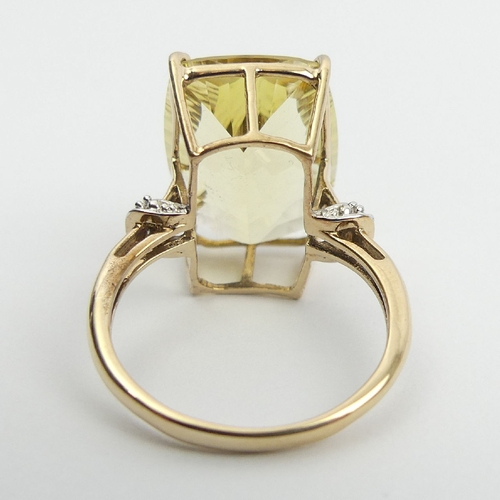 75 - 9ct gold yellow quartz and diamond ring, 4.4 grams, 17. 8mm, Size N. UK Postage £12.