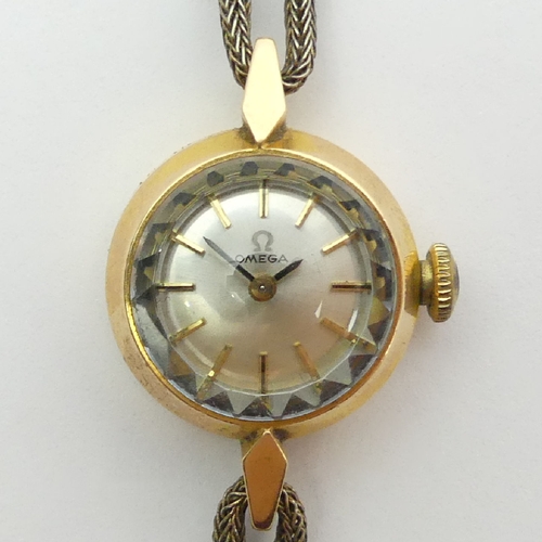 79 - Ladies Omega 14ct gold manual wind watch, 18mm including button. UK Postage £12. Condition Report: W... 