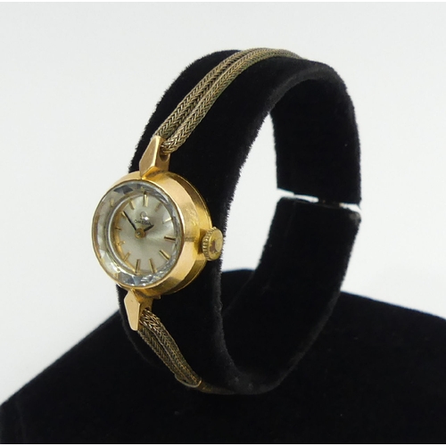 79 - Ladies Omega 14ct gold manual wind watch, 18mm including button. UK Postage £12. Condition Report: W... 