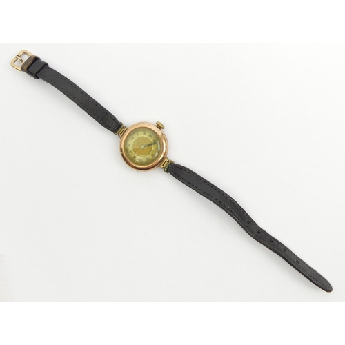 83 - 1920's 9ct gold watch on a leather strap, 27mm wide including button. UK Postage £12.