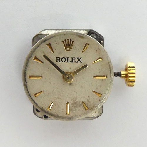 97 - 18t gold Ladies Rolex manual wind, dating from 1954, on a rolled gold strap, 20mm including button. ... 