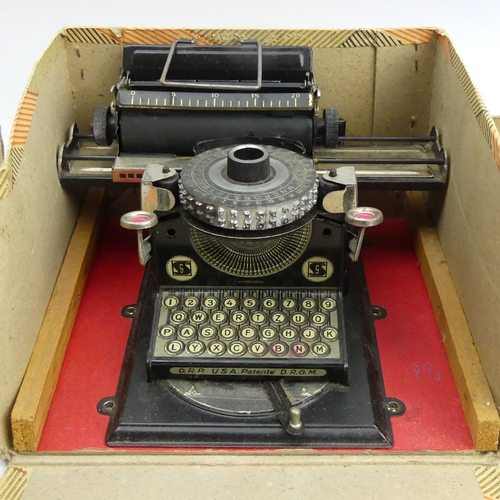 309 - Dinky Toys 564 elevator loader and an old tin plate toy typewriter. UK Postage £16