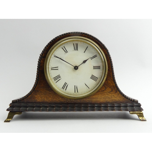 337 - Edwardian Oak cased mantel clock on brass feet, 21 x 14 x 8cm. UK Postage £12
Condition Report: In w... 