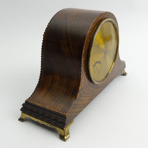 337 - Edwardian Oak cased mantel clock on brass feet, 21 x 14 x 8cm. UK Postage £12
Condition Report: In w... 