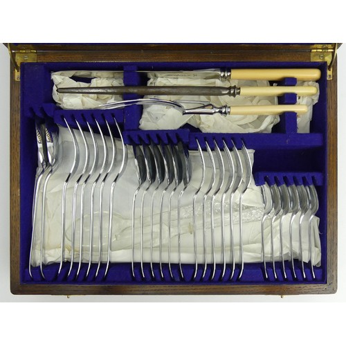 115 - An oak cased canteen of cutlery, James Ryals, Sheffield. 41 pieces and two cut glass salad servers, ... 