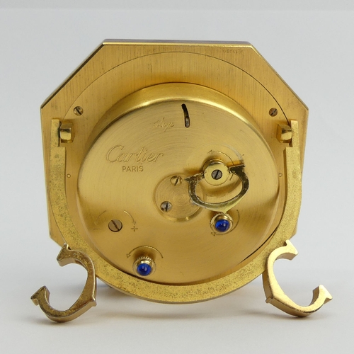 169 - Cartier gilt and maroon travel alarm clock, 7.5cm high. UK Postage £12.
Condition Report: Working Or... 