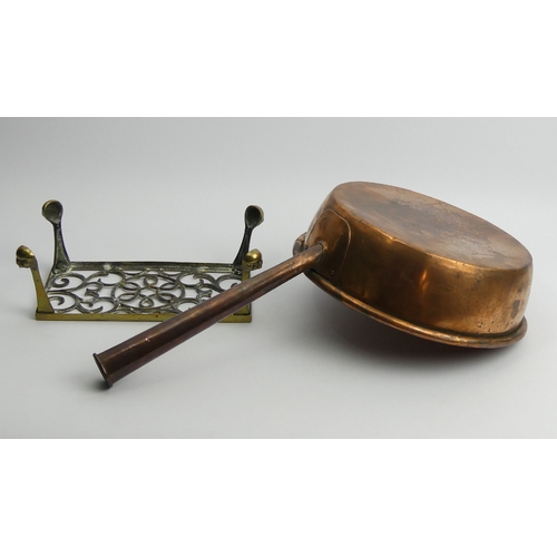 174 - A large copper pan and an old brass trivet, 
pan 52cm x 30cm. UK Postage £18.