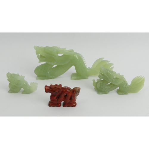 184 - Three Chinese carved Jade dragons and a red hardstone example, largest 18cm x 7cm. UK Postage £12.