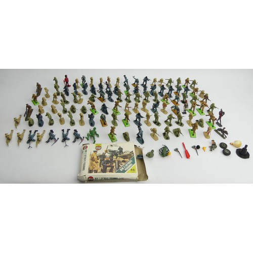 320 - A box of Britains and other toy soldiers. UK Postage £12.