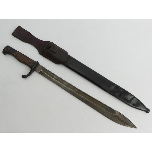 124 - German sawback 'Butcher Blade' bayonet, made by Kerschbaum in a leather scabbard dated 1915, 52.2cm.... 