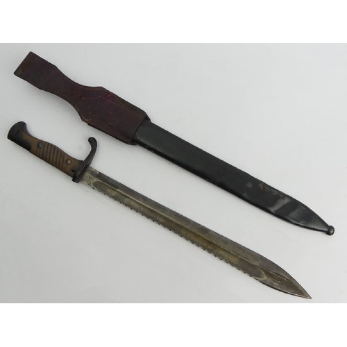 124 - German sawback 'Butcher Blade' bayonet, made by Kerschbaum in a leather scabbard dated 1915, 52.2cm.... 