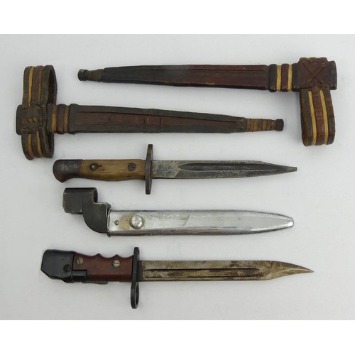 132 - Three bayonets one with it's scabbard and two leather scabbards, scabbards 33.5cm. UK Postage £16.