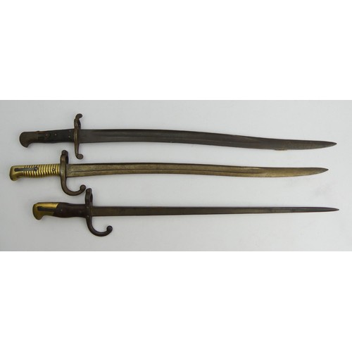 133 - A French brass handled bayonet and two others, longest 71cm. UK Postage £18.