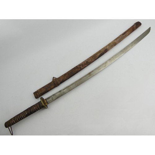 135 - A Japanese, believed to be, World War II Kutana with scabbard, the top of the blade with inscribed c... 