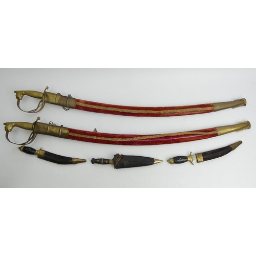 140 - Two decorative swords and three knives with scabbards, all probably South Asian, swords 97cm. UK Pos... 