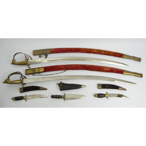 140 - Two decorative swords and three knives with scabbards, all probably South Asian, swords 97cm. UK Pos... 