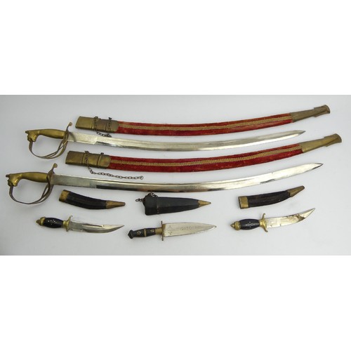 140 - Two decorative swords and three knives with scabbards, all probably South Asian, swords 97cm. UK Pos... 