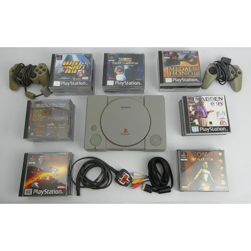 329 - Playstation 1 console, controllers and games. UK Postage £18.