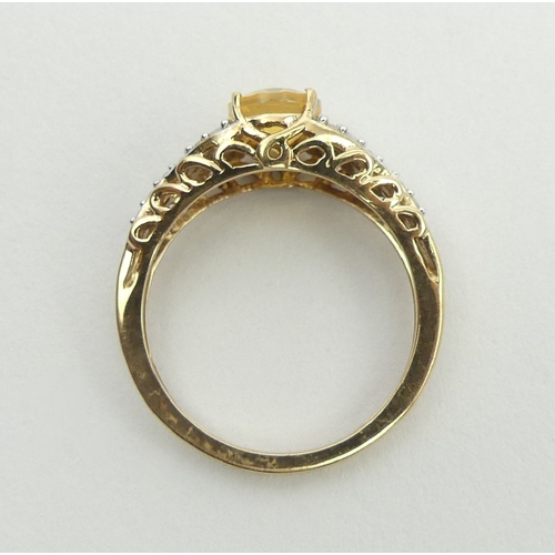 12 - 9ct gold fire opal and diamond ring, 2.6 grams, 8.1mm, size N. UK postage £12.