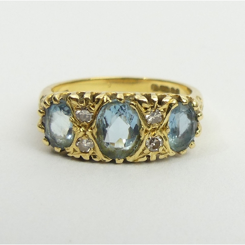 16 - 18ct gold three stone aquamarine and diamond ring, London 1979, 5.5 grams, 8.2mm size P. UK postage ... 