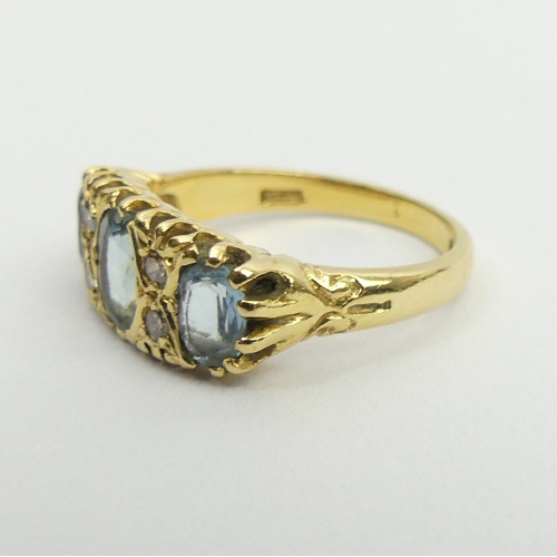 16 - 18ct gold three stone aquamarine and diamond ring, London 1979, 5.5 grams, 8.2mm size P. UK postage ... 