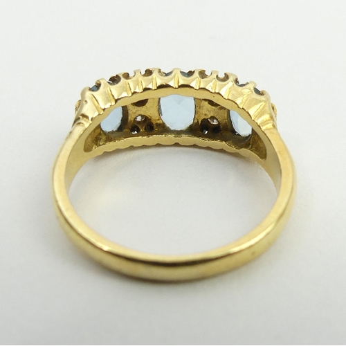 16 - 18ct gold three stone aquamarine and diamond ring, London 1979, 5.5 grams, 8.2mm size P. UK postage ... 