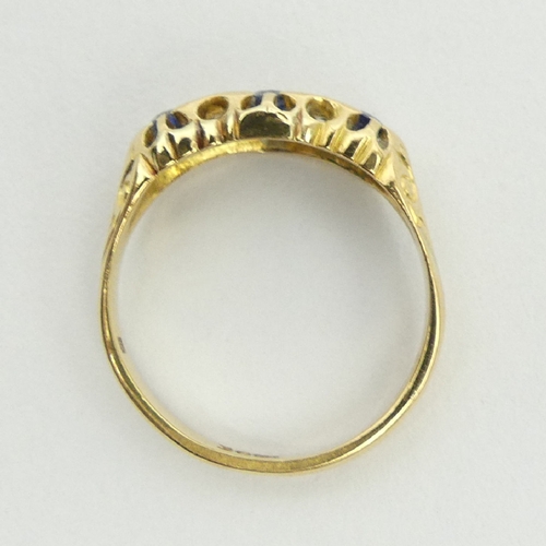 17 - 18ct gold three stone sapphire and diamond ring, 3.1 grams, 6.9mm, size O. UK postage £12.