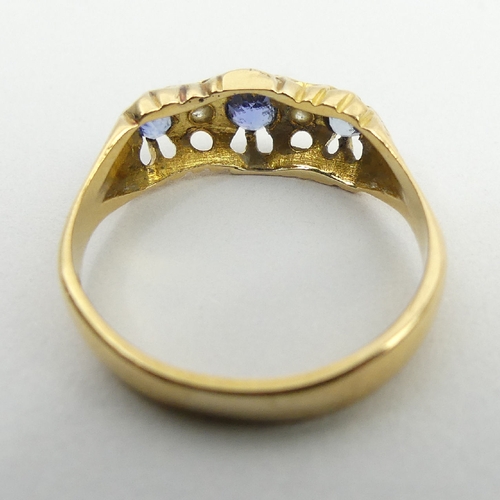 17 - 18ct gold three stone sapphire and diamond ring, 3.1 grams, 6.9mm, size O. UK postage £12.