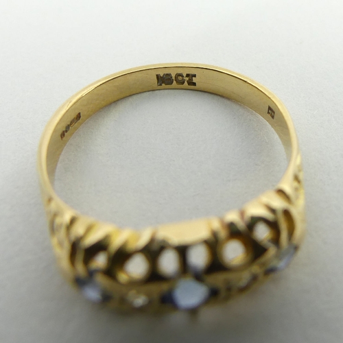 17 - 18ct gold three stone sapphire and diamond ring, 3.1 grams, 6.9mm, size O. UK postage £12.