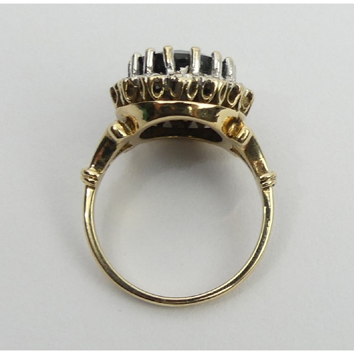 18 - 9ct gold sapphire and diamond ring, Birm.1990, 6.2 grams, 17.1mm, size O. UK postage £12.