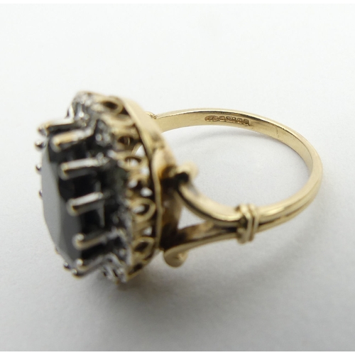 18 - 9ct gold sapphire and diamond ring, Birm.1990, 6.2 grams, 17.1mm, size O. UK postage £12.