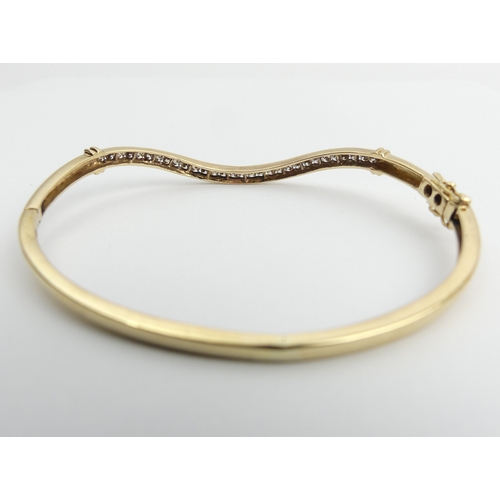 20 - 9ct gold wave design diamond set bangle, 9.7 grams, 3mm, UK postage £12.