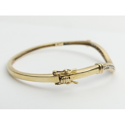 20 - 9ct gold wave design diamond set bangle, 9.7 grams, 3mm, UK postage £12.