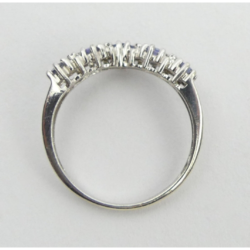 21 - 9ct white gold tanzanite and diamond ring, 1.8 grams, 3.3mm, size M1/2. UK postage £12