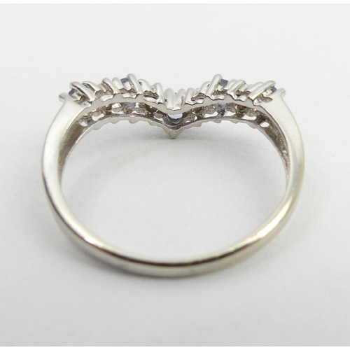 21 - 9ct white gold tanzanite and diamond ring, 1.8 grams, 3.3mm, size M1/2. UK postage £12