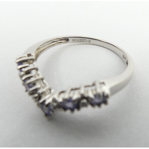 21 - 9ct white gold tanzanite and diamond ring, 1.8 grams, 3.3mm, size M1/2. UK postage £12