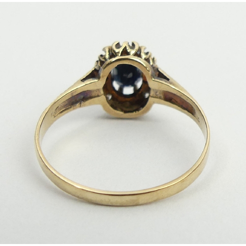 23 - 9ct gold sapphire and diamond ring, Birm. 1985, 1.8 grams, 10.2mm, size P1/2. UK postage £12.