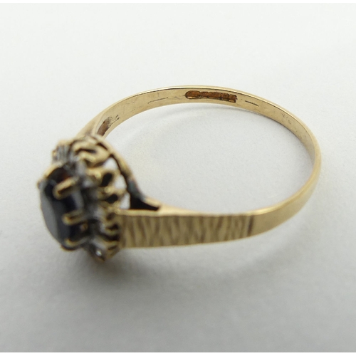 23 - 9ct gold sapphire and diamond ring, Birm. 1985, 1.8 grams, 10.2mm, size P1/2. UK postage £12.