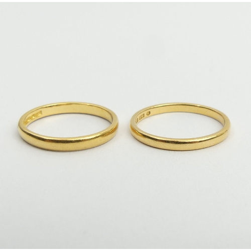 24 - Two 22ct gold wedding rings, 4.7 grams, size L & L1/2, UK postage £12.