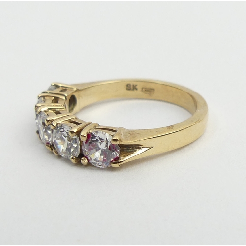 6 - 9ct gold five stone ring, 3.5 grams, 4.6mm, size K. UK postage £12.