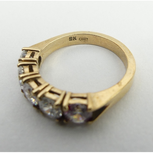 6 - 9ct gold five stone ring, 3.5 grams, 4.6mm, size K. UK postage £12.