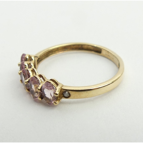 29 - 9ct gold pink tourmaline and diamond ring, 1.5 grams, 5.1mm, size N1/2. UK postage £12.